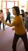 A varied group of people practicing Tai Chi