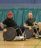 Two people playing wheelchair basket ball